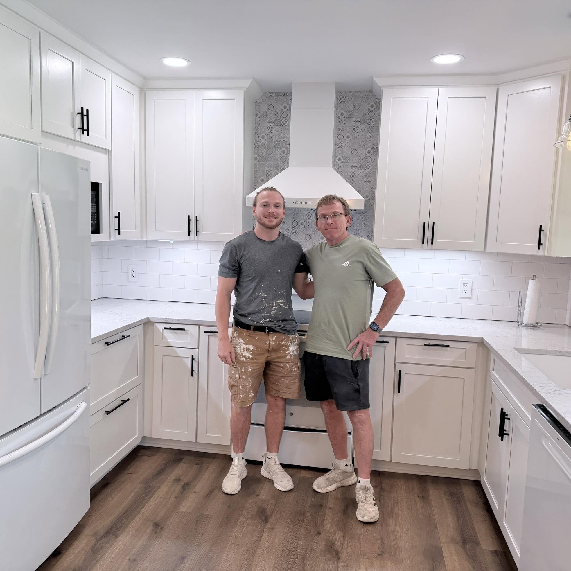 Corey and Collin Lemon standing in a finished kitchen project